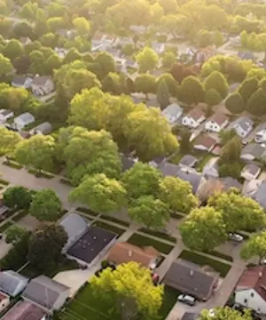 Aerial view of American suburb at summertime.
