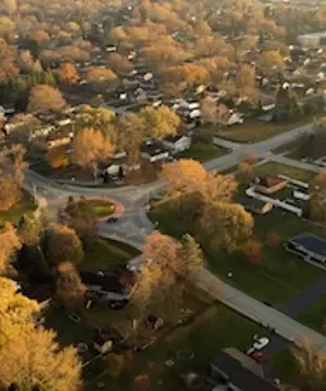 Aerial drone view of American suburban neighborhood.